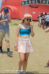 Festival fashion in full-force ranging from cut-off denim shorts, headbands, crop-tops, and graphic T-shirts.