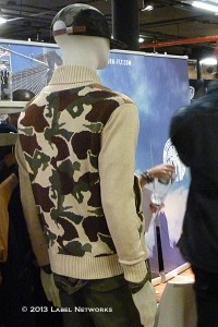 Classic zip-up collared sweaters but with camo motifs add dimension to the style.