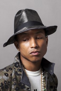 Pharrell Williams wearing custom Chanel pearls and chains.