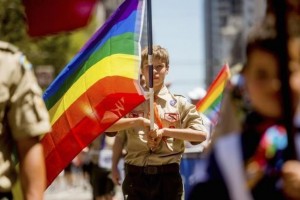 Boy Scout Casey Chambers carries a rainbow flag during the San Francisco Gay Pride Festival in California June 29, 2014. Photo by Reuters/Noah Berger.